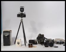 Vintage camera and lenses to include an Olympus OM10 35mm camera ( x 2 ) folding camera, Tamron 60-