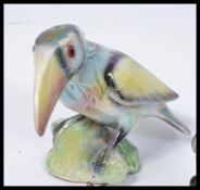 A collection of retro vintage 20th Century Kitsch items to include three cast metal graduating