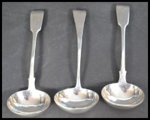A group of three 19th century silver hallmarked sauce ladles to include a Victorian pair by