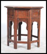 An Eastern 19th century octagonal inlaid Benares table profusely inlaid with with brass53x52