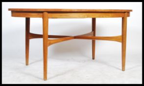 A retro 20th century circa 1960's Beithcraft organic range teak wood extending dining table of round