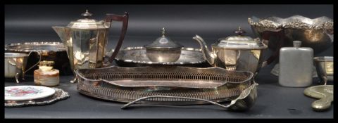 A collection of silver plate to include tea service , trays , large punch bowl / center piece etc.