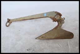 A 20th century heavy cast metal anchor from a sailing boat / ship being of typical form ( see