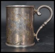A 19th century Victorian silver hallmarked tankard of cylindrical form having a scrolled handle.