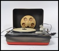 A vintage 20th Century two tone portable record player by Schneider, single speaker fitted to the