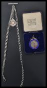 A hallmarked silver albert T bar fob chain with fob medal along with a silver and enamel fob medal