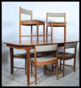 Mcintosh of Kirkcaldy - A retro vintage 1970's teak wood dining suite comprising of an extending