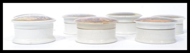 A group of seven 19th century Victorian ceramic Prattware pictorial pot lids and bases to include