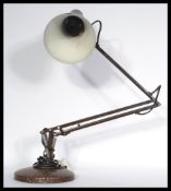 Two vintage retro 20th century anglepoise lamps one being a 1001 lamps example and the other in a