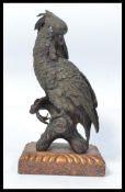 A good sized cold painted  bronze figure of a cockatoo standing on a marble base in the manner of