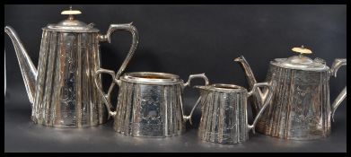 A vintage 20th Century silver plated four piece tea service consisting of teapot, water pot, sugar