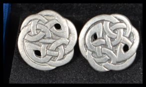 A pair of pewter Celtic knot cuff links stamped Liberty to verso.