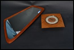 A mid Century retro Danish teak framed mirror having stamp to the reverse together with a vintage