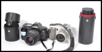 A collection of vintage 35mm cameras to include Canon EOS 1000, Minolta digital, sigma lens, Canon