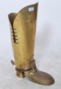 A large vintage 20th century novelty brass stick stand in the form of a large brass cavalier`s