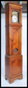 A 19th century French longcase / comptoise grandfather clock. The white enamel dial signed fpor L