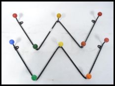 A pair of vintage mid 20th century Sputnik Atomic Space Age coat hooks having ebonised zig-zag backs