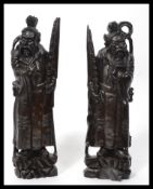 A pair of 19th century Chinese carved hardwood figures of Deity's / Immortals raised on a