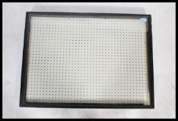 A vintage 20th century shop display case having a large glass front with ebonised case surround. The