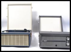 Two vintage 20th Century portable two tone record players both by Fidelity