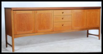 A stunning vintage / retro 20th Century teak wood 7 foot sideboard by Nathan. The central bank of