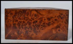 A good quality Amboyna wood tea caddy / cigar box of 20th century origin, rectangular form with