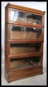 An Edwardian oak  4 section /  tier lawyers - barristers stacking bookcase cabinet by  Globe