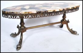 A good mid century Pietra Dura style marble coffee table. Of oval lozenge form having lovely
