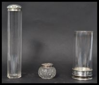 A group of three silver hallmarked and glass items to include a faceted tall cylindrical silver