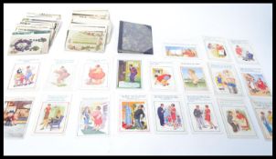 A collection of vintage postcards dating from the early 20th century to include comical, nude,