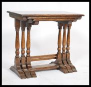 An antique style oak nest of tables in the Jacobean manner. Of solid oak construction with