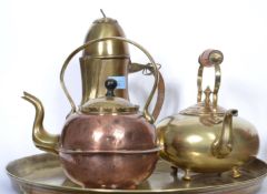 A group of three vintage brass kettles / coffee pots to include an Islamic style coffee pot,