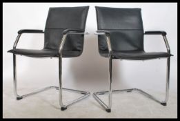 A pair of retro style  chrome cantilever elbow chairs with original black leatherette back and