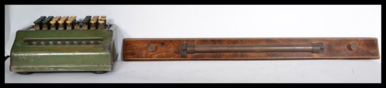 A vintage 20th century retro industrial Bell Punch Company enamelled calculator along with a