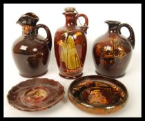 A good collection of Royal Doulton kingsware liqueur flasks to include the pied piper liquer flask