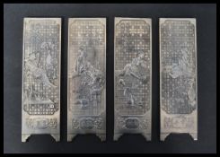 A group of four Oriental Chinese silver white metal miniature discretionary screens depicting scenes