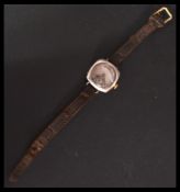 A vintage early 20th century Rolex 1917 trench military interest watch having a silvered dial Arabic