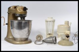 A vintage mid century Kenwood Major kitchen mixer complete with accessories. The vintage mixer of