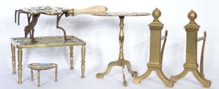 A collection of four brass trivet stands dating the 18th / 19th Century to include examples on