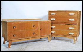 Two retro 20th Century teak wood chest of drawers raised on tapering legs together with a retro teak