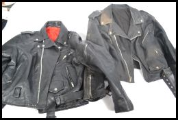 Two vintage 20th Century leather bikers / rockers motorcycle jackets, zippers and buttons to the