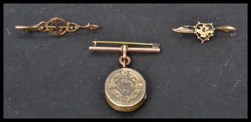 A 9ct gold Naval nautical anchor sweetheart brooch along with another heart shaped 9ct gold brooch