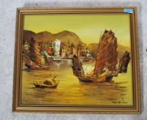 A vintage 20th century oil on board painting of a Hong Kong Junk boat ship signed to lower corner.