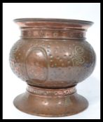 A stunning early 20th Century Arts and Crafts copper hand worked planter with marks to the base