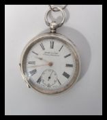 An early 20th century silver hallmarked ACME Lever pocket watch. The white enamel face having a