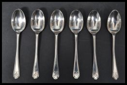 A set of six silver hallmarked Walker and Hall tea spoons having golfing interest terminal handles