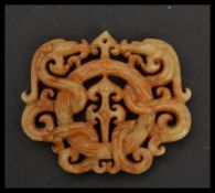 A Chinese mottled jade / jadeite bi disc having dragons and scrolls. Please see images. Measures 6.5