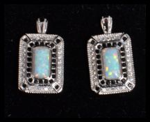 A pair of sterling silver marcasite and opal set earrings of rectangular form complete in