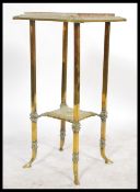 A vintage 20th century Antique style marble topped planter stand of gilt brass construction.