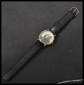 A 20th century Chairman Mao wrist watch having a printed portrait dial with gilt dot numerals and